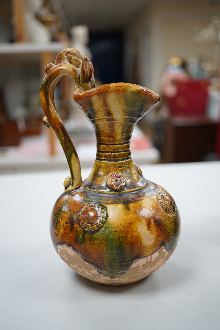 A Chinese pottery jug, two hardstone discs and a metal seal. Jug 17.5cm high